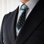 کراوات سوزن دوزی بلوچی طرح مثلثی فیروزه‌ای